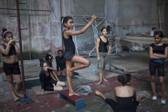Children take a break during a training session at a circus school in Havana