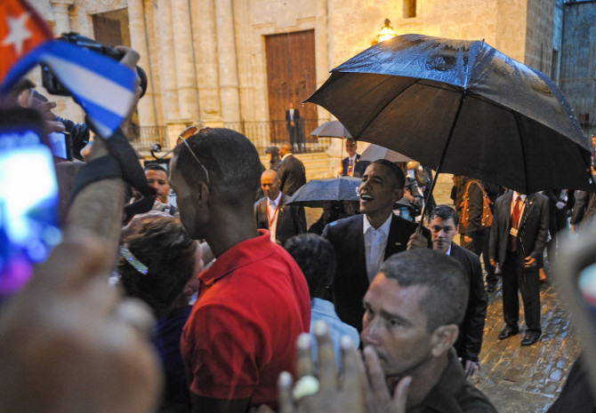 US President Barack Obama talks to tourists and Cubans at his arrival to the Havana Cathedral, on March 20, 2016.  On Sunday, Obama became the first US president in 88 years to visit Cuba, touching down in Havana for a landmark trip aimed at ending decades of Cold War animosity.   AFP PHOTO/YAMIL LAGE / AFP / YAMIL LAGE        (Photo credit should read YAMIL LAGE/AFP/Getty Images)