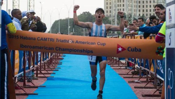 Argentinian Juan Manuel Asconape celebrates at the finish line as he wins the first place in the Ibero-American Triathlon Championship in Havana, on Jan. 25, 2015 | Photo: AFP This content was originally published by teleSUR at the following address: "http://www.telesurtv.net/english/news/Over-400-Athletes-from-32-Nations-Competing-in-Cubas-Triathlon-20160213-0020.html". If you intend to use it, please cite the source and provide a link to the original article. www.teleSURtv.net/english