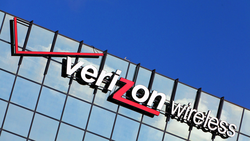 Corporate logo of Verizon wireless on the mirrored-glass of an office building, in April 2013. Photo by: Frank Duenzl/picture-alliance/dpa/AP Images