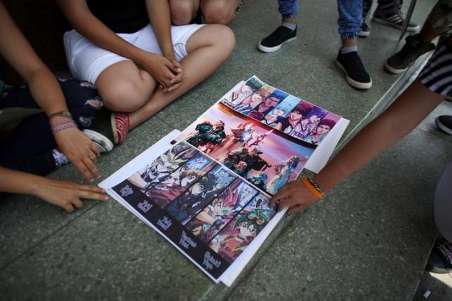 Posters are displayed for selling at the entrance of a cinema where the Cuban Otaku festival is taking place in Havana, Cuba, July 24, 2016. REUTERS/Alexandre Meneghini