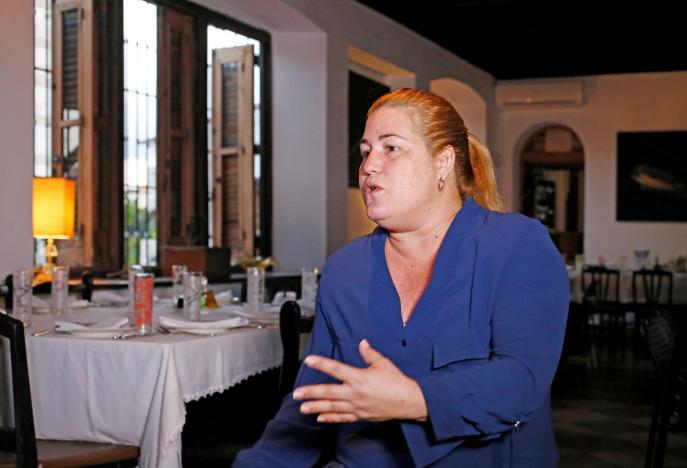Cuban entrepreneur Niuris Higueras gives an interview to Reuters in her restaurant Atelier in Havana, Cuba, November 27, 2016. REUTERS/Stringer