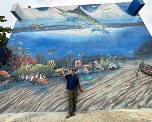 American artist paints giant mural at the National Aquarium of Cuba