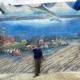 Artista estadounidense pinta mural gigante en el Acuario Nacional de Cuba